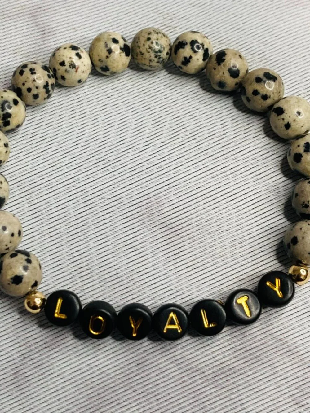 Faithful Energy – Dalmatian Jasper Bracelet with Loyalty Charm